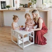 Children playing at a 2in1 kitchen tower and table set for kids.