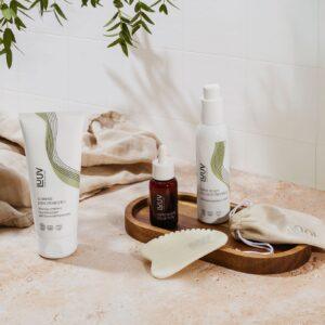 Care-E-Well Cellulite-Behandlung Produkte auf natürlichem Steinboden.
