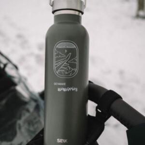 Eco-friendly 500ml water bottle with mountain and lake design for outdoor use.