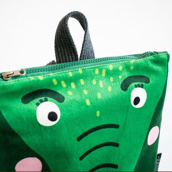 Kids backpack with a crocodile face design, green color, and playful features.
