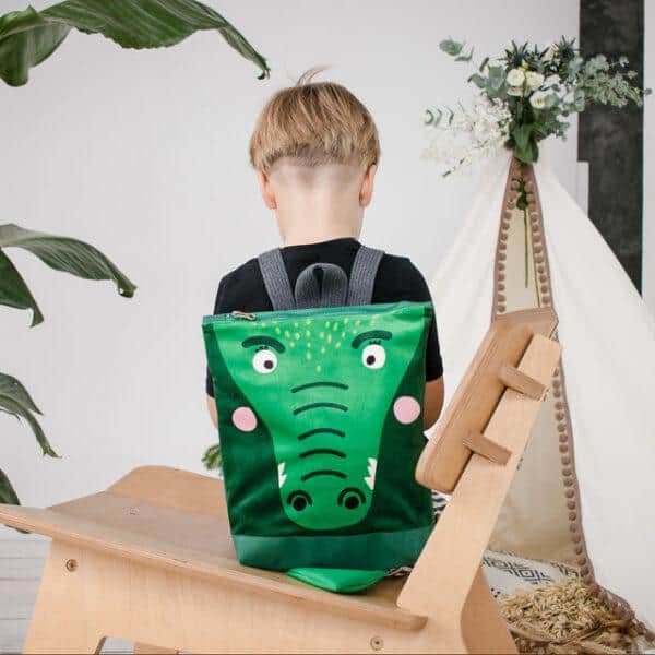Kids backpack with crocodile design for children, suitable for school or outings.