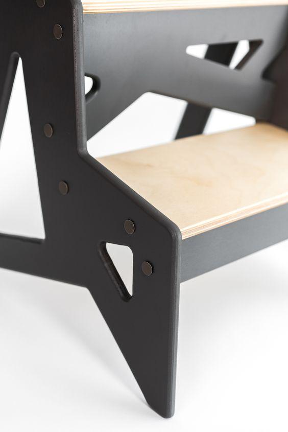 Modern wooden step stool with black metal frame for children or adults.