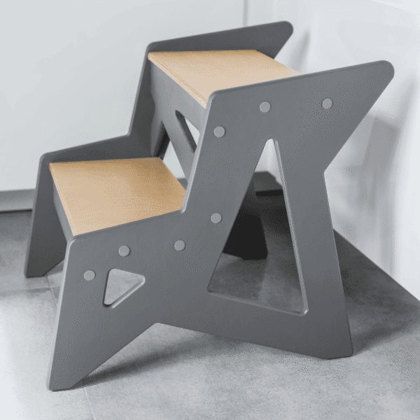 Modern wooden step stool with gray frame and natural wood top for children.