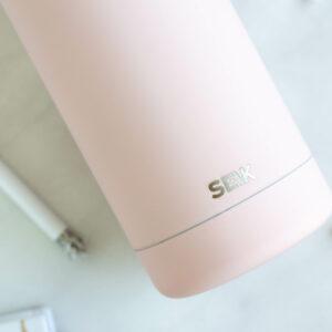 SEIK water bottle in pink color with sleek design and logo visible.