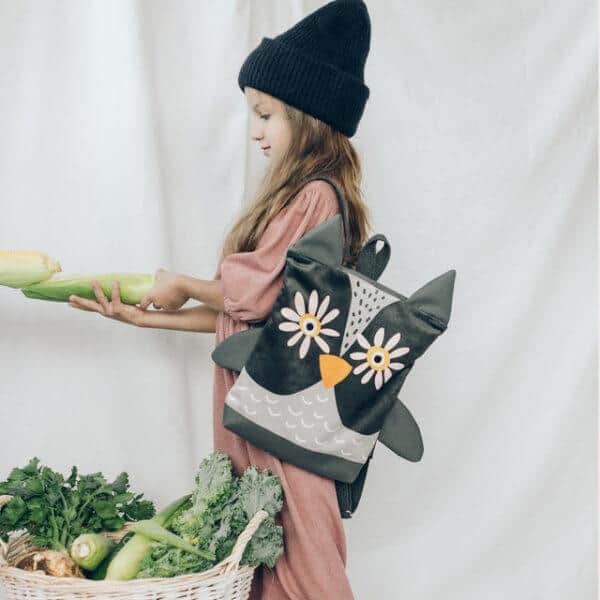 Kids backpack owl design with flowers and wings for children.