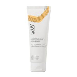 Pflegende Honig-Fußcreme in weißer Tube mit goldenen Linien.