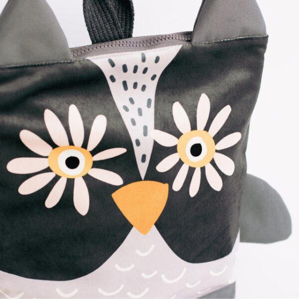 Kids backpack with owl face design, perfect for children.