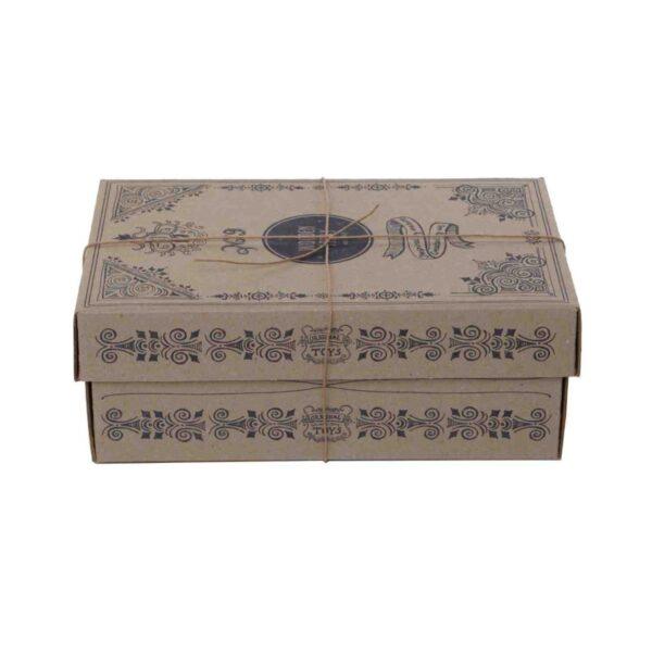 Colorful pounding bench with intricate designs on cardboard surface.