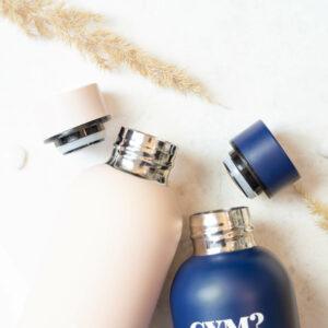 Stylish water bottles in lilac and navy with metallic accents on a white background.