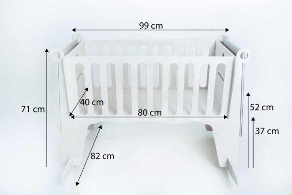 White baby cradle with dimensions and safety features for infants.