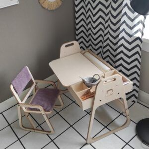 Adjustable children Montessori table and chair set in a cozy room.