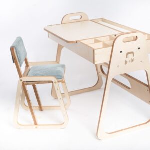 Adjustable Montessori children table and chair set in mint green and natural wood.