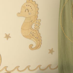 Wooden seahorse wall decoration with starfish and wave motifs for children's room.