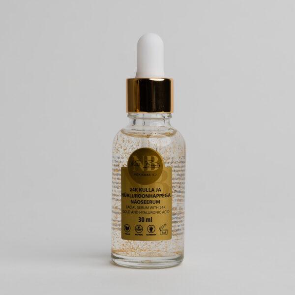 Gesichtsserum mit 24K Gold und Hyaluronsäure in Glasflasche.