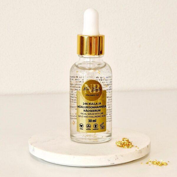 Luxus Gesichtsserum mit 24K Gold und Hyaluronsäure in Glasflasche.